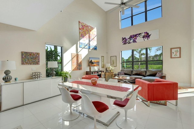 dining room featuring vaulted ceiling, ceiling fan, and light tile patterned flooring