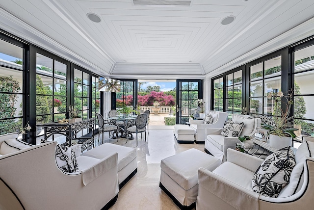 sunroom / solarium with a healthy amount of sunlight and wooden ceiling