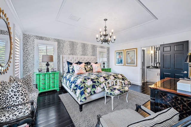 bedroom with an inviting chandelier, crown molding, and dark wood-type flooring