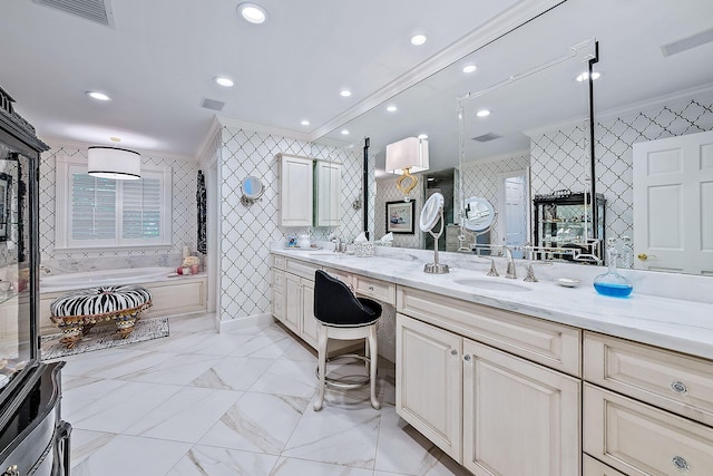 bathroom with ornamental molding, a bath, and vanity