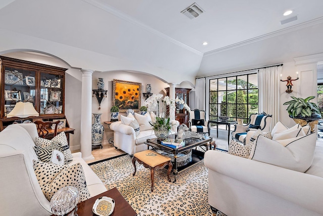 living room with ornamental molding, lofted ceiling, tile patterned flooring, and ornate columns