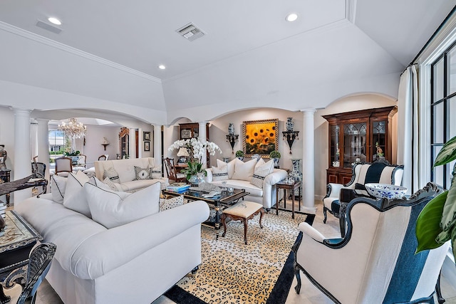 living room with crown molding, lofted ceiling, and ornate columns