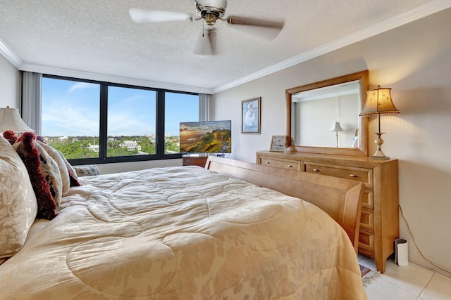 tiled bedroom featuring ceiling fan, crown molding, and a textured ceiling