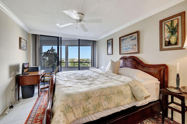 bedroom featuring light tile patterned floors, floor to ceiling windows, ornamental molding, a textured ceiling, and access to outside