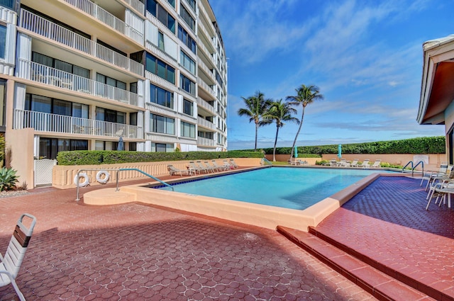 view of swimming pool with a patio area