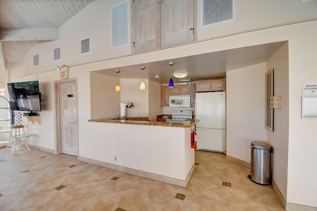 kitchen with pendant lighting, white appliances, light tile patterned floors, light stone countertops, and beam ceiling