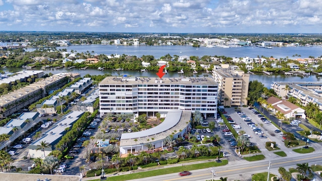 birds eye view of property with a water view