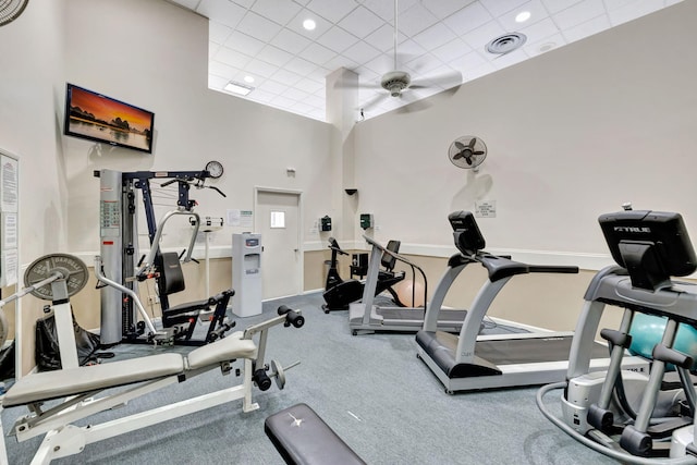 workout area featuring a drop ceiling and ceiling fan