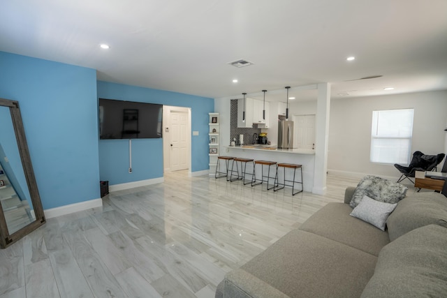 living room with light hardwood / wood-style flooring