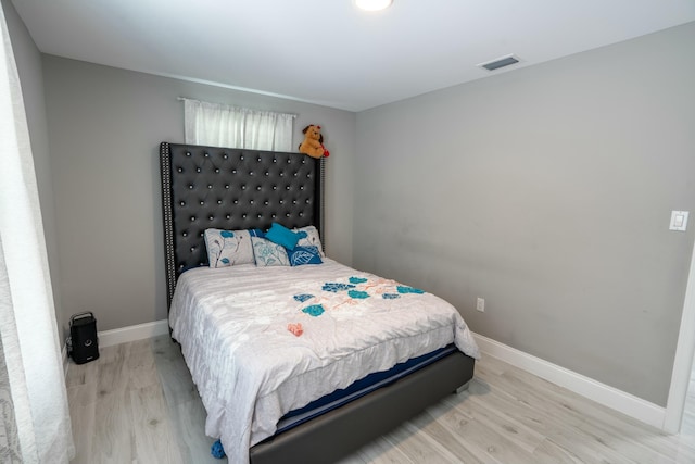 bedroom with light hardwood / wood-style floors