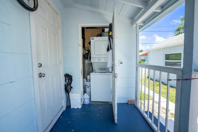 view of exterior entry featuring stacked washer / drying machine