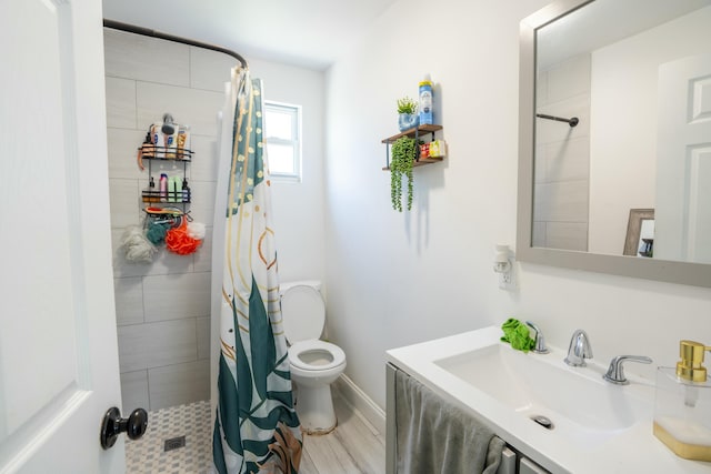 bathroom with sink, hardwood / wood-style flooring, toilet, and walk in shower