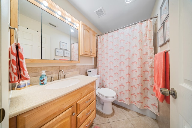 full bathroom featuring tile patterned floors, visible vents, toilet, and vanity