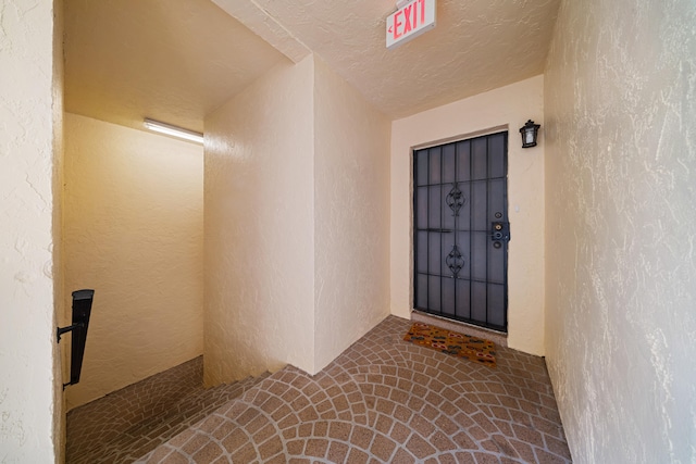 property entrance featuring stucco siding