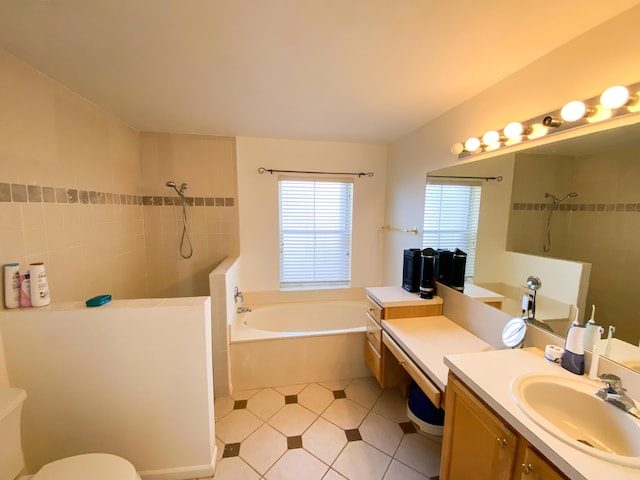 full bath with a garden tub, a tile shower, and vanity