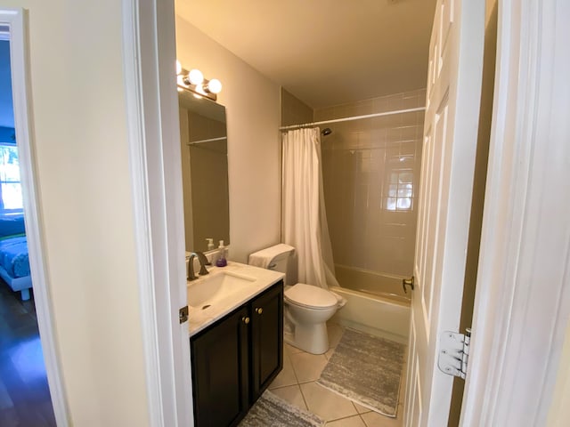10586 Pelican Dr, Wellington, FL 33414 - full bath with shower / bath combo, vanity, tile patterned flooring, and toilet
