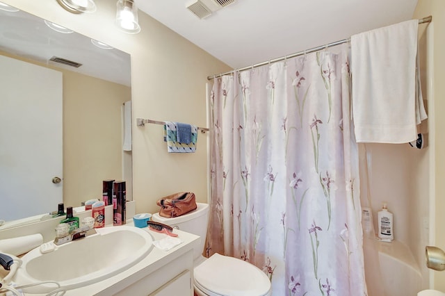 full bathroom with vanity, toilet, and shower / bath combo