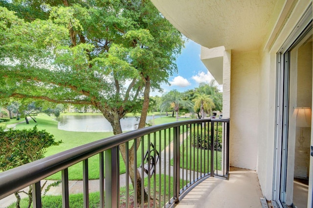 balcony featuring a water view