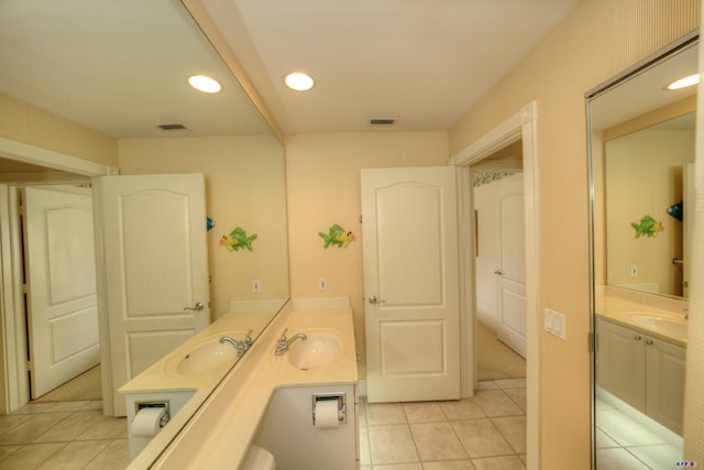 bathroom featuring tile patterned flooring and vanity