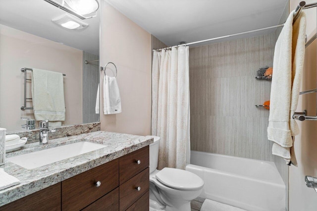 full bathroom featuring vanity, shower / tub combo, and toilet