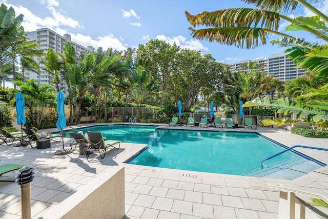 view of swimming pool featuring a patio area