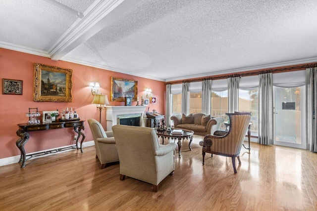 living room with crown molding, a textured ceiling, and light hardwood / wood-style floors