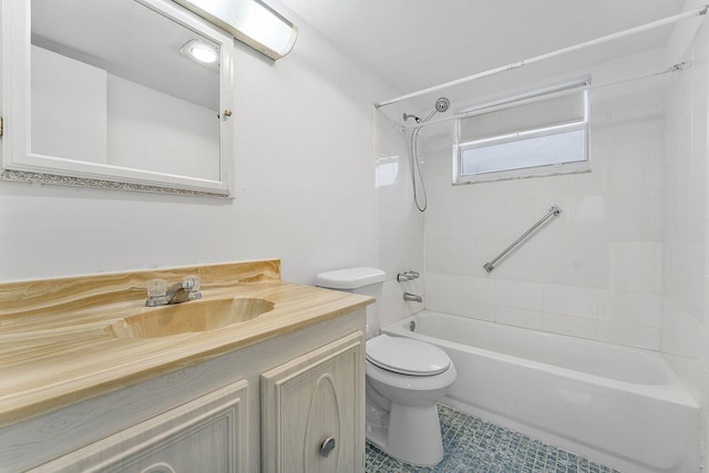 full bathroom with vanity, tiled shower / bath combo, and toilet