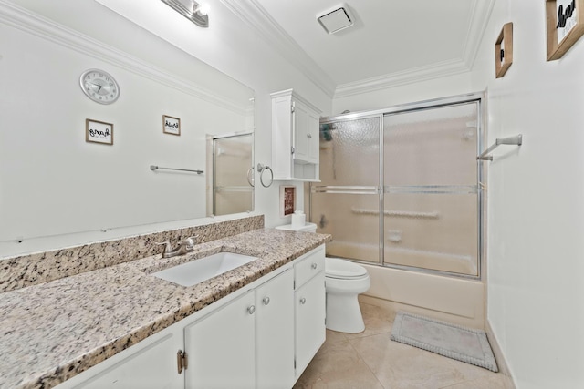 full bathroom featuring combined bath / shower with glass door, tile patterned flooring, vanity, ornamental molding, and toilet