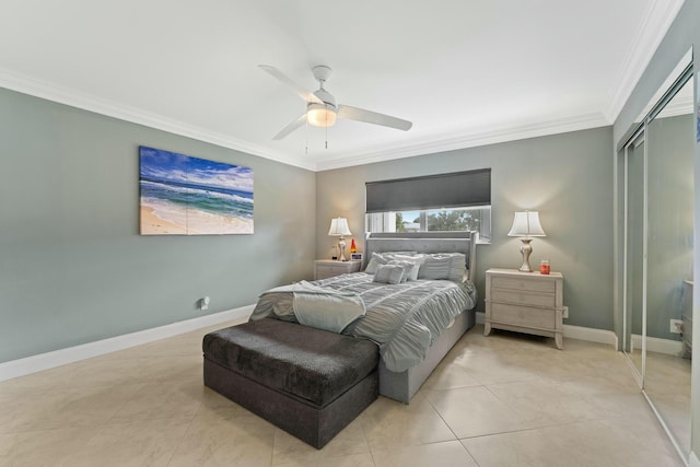 tiled bedroom featuring ornamental molding, a closet, and ceiling fan