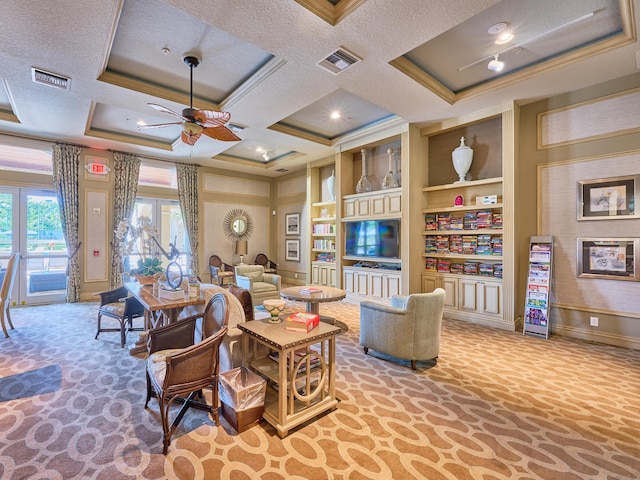 living room with built in shelves, coffered ceiling, crown molding, a textured ceiling, and ceiling fan