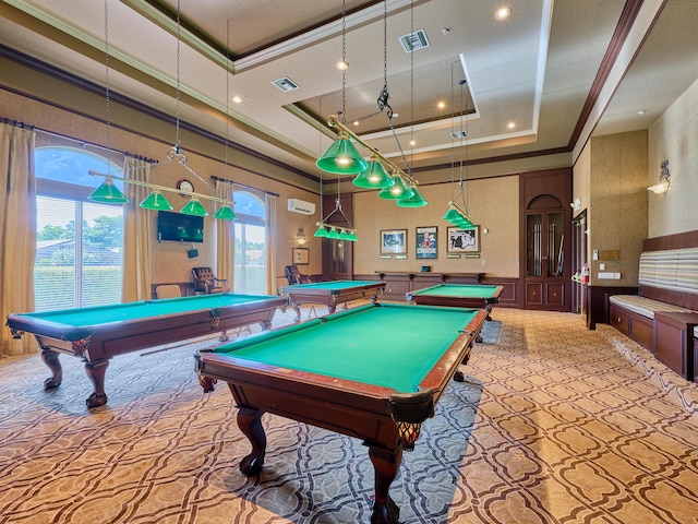 recreation room featuring ornamental molding, plenty of natural light, a towering ceiling, and a tray ceiling