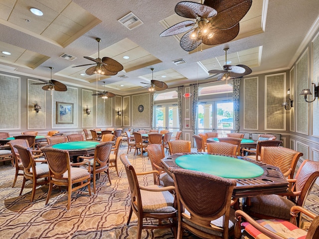 playroom featuring a tray ceiling, crown molding, coffered ceiling, and french doors