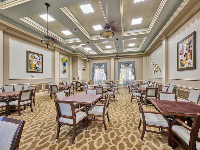 carpeted dining space with ornamental molding