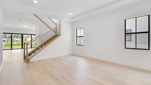 unfurnished living room featuring light wood-type flooring