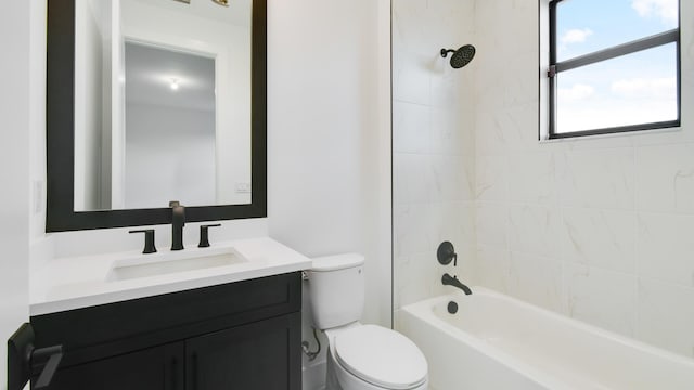 full bathroom featuring vanity, toilet, and tiled shower / bath combo