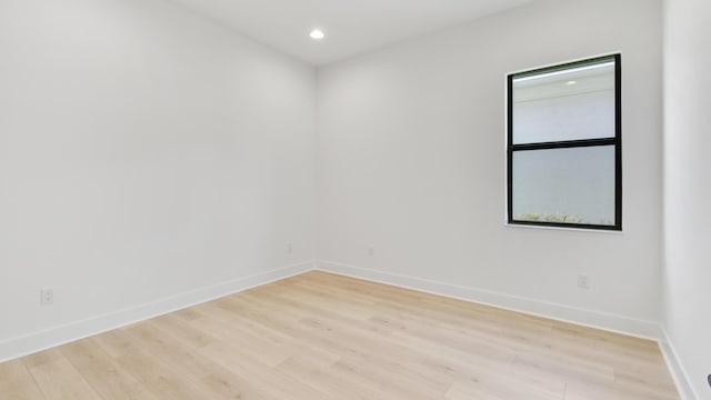 spare room with light wood-type flooring