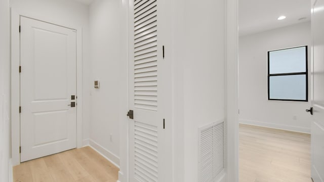 hallway with light wood-type flooring