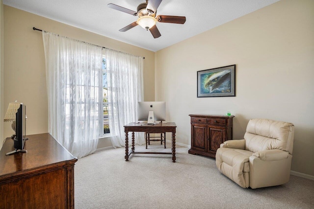 living area featuring ceiling fan and light carpet