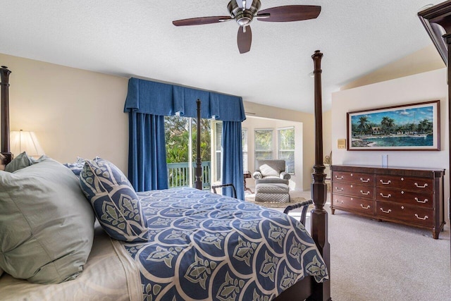 carpeted bedroom featuring ceiling fan, access to outside, a textured ceiling, and vaulted ceiling