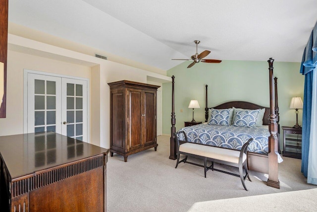 bedroom with french doors, ceiling fan, lofted ceiling, and light carpet