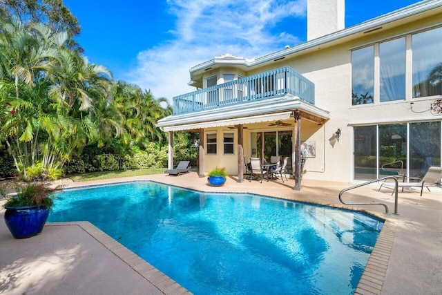 view of pool featuring a patio