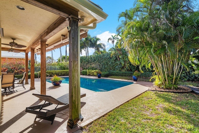 view of pool with a patio area and ceiling fan