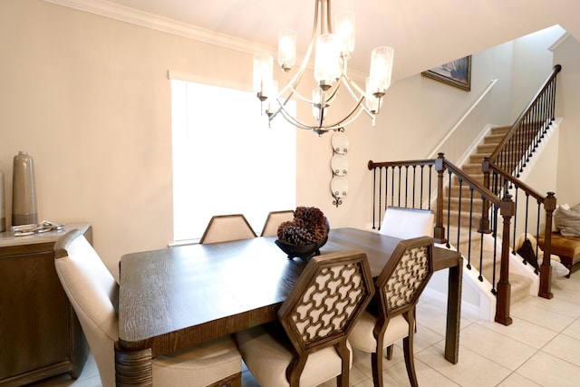 tiled dining space with ornamental molding, a chandelier, and a healthy amount of sunlight