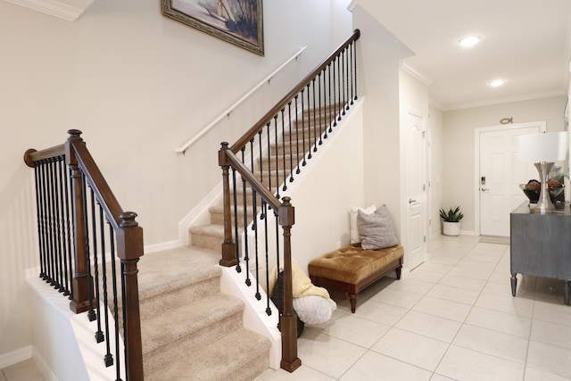 stairway featuring tile patterned flooring and ornamental molding