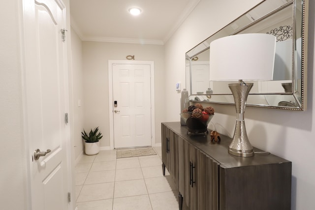 doorway to outside featuring ornamental molding and light tile patterned floors