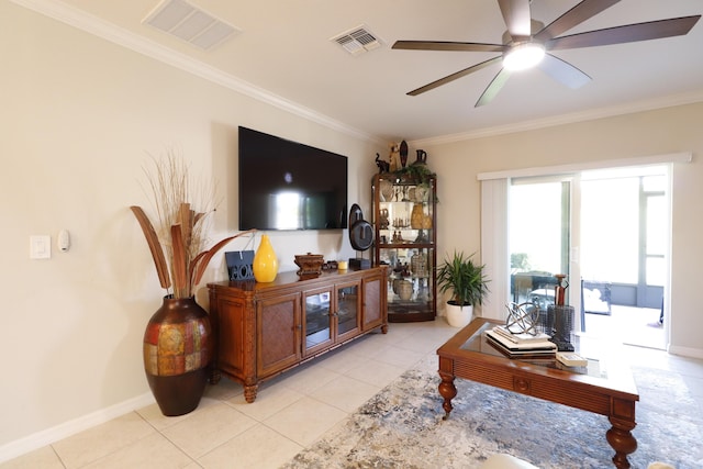 living room with light tile patterned floors, crown molding, and ceiling fan