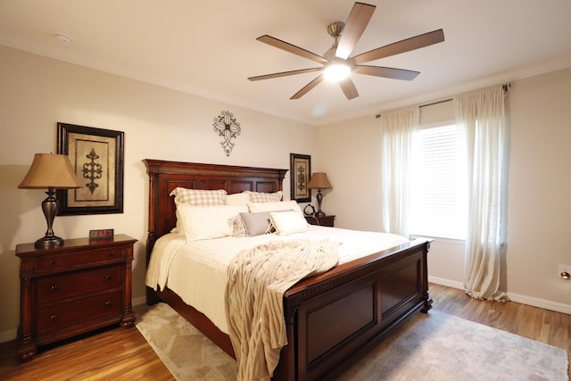 bedroom featuring light hardwood / wood-style flooring and ceiling fan