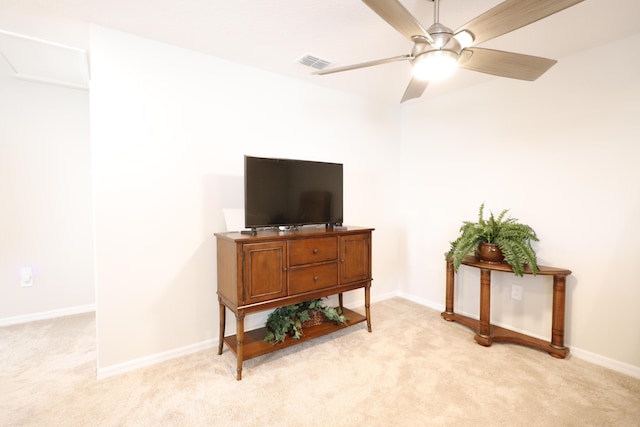 living room featuring light colored carpet and ceiling fan