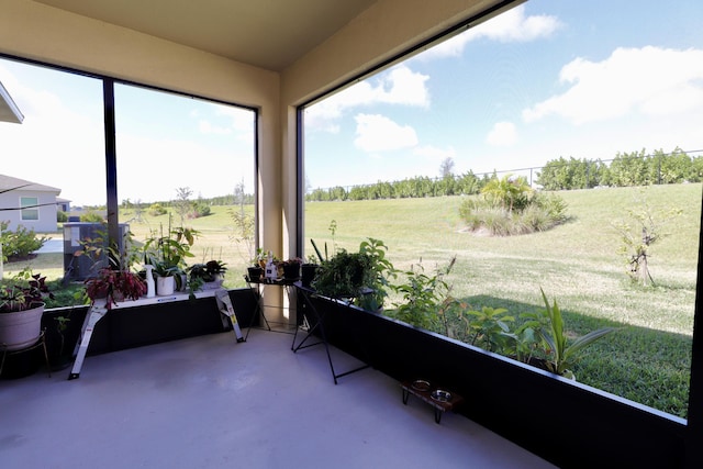 sunroom / solarium featuring a rural view