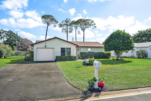 ranch-style house with a garage and a front yard